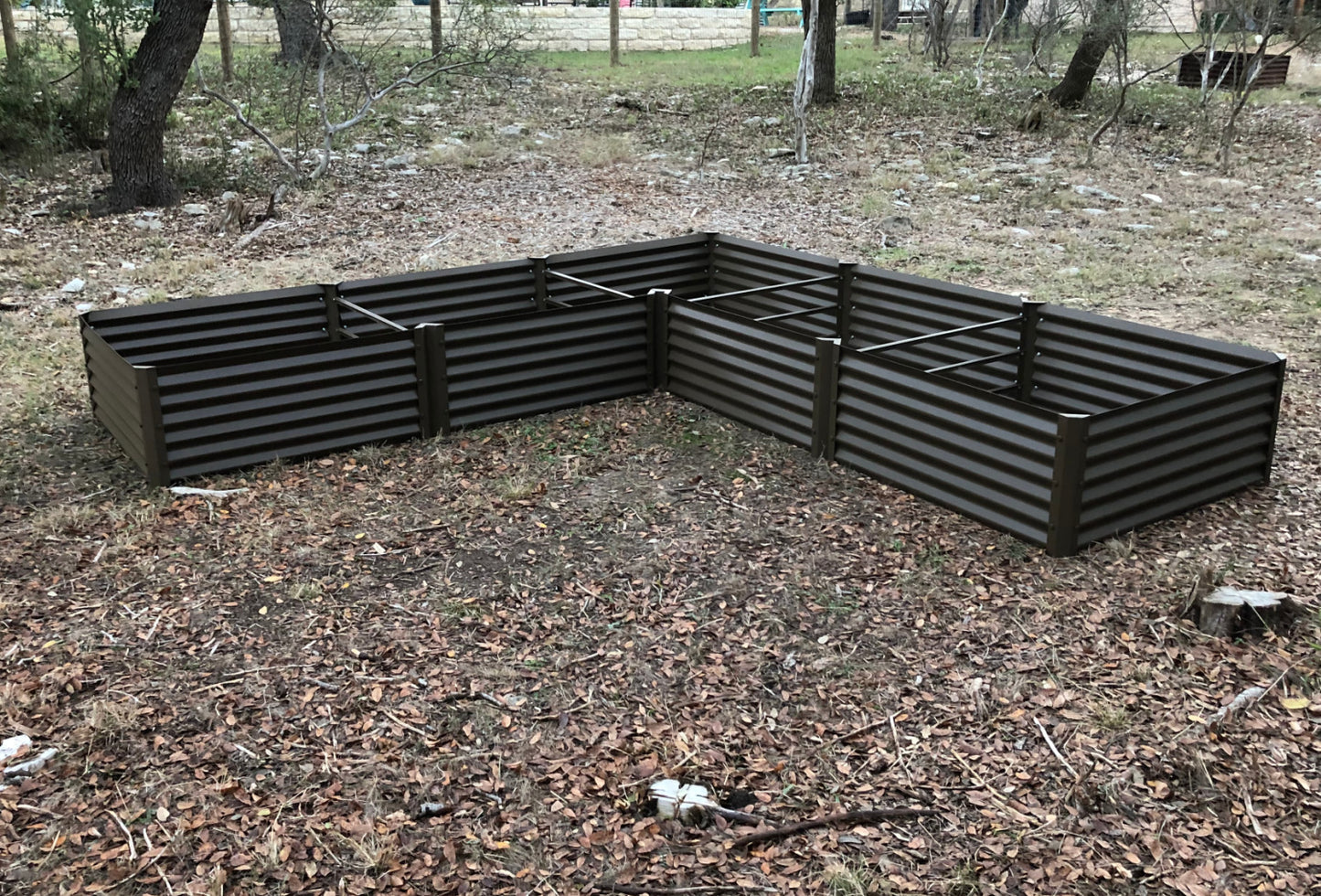 rustic long L raised garden bed installed